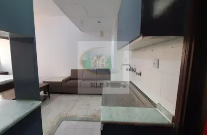 Kitchen image for: Apartment - 1 Bathroom for rent in Hamdan Street - Abu Dhabi, Image 1