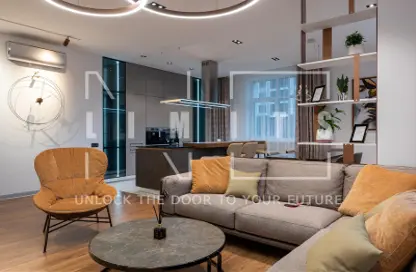 Living Room image for: Apartment - 1 Bedroom - 2 Bathrooms for sale in Vita Grande - Jumeirah Village Circle - Dubai, Image 1