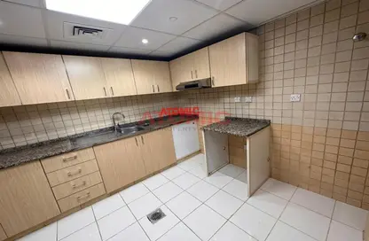 Kitchen image for: Apartment - 2 Bedrooms - 2 Bathrooms for rent in Al Noor 1 - Al Noor Towers - Barsha Heights (Tecom) - Dubai, Image 1