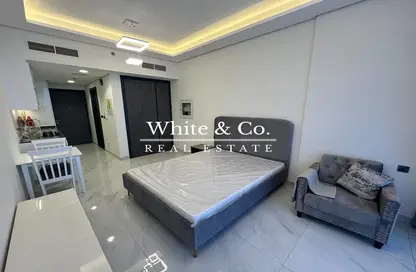 Room / Bedroom image for: Apartment - 1 Bathroom for rent in Samana Golf Avenue - Dubai Studio City - Dubai, Image 1