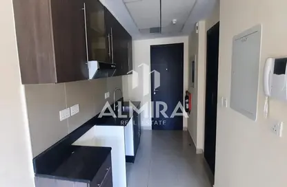 Kitchen image for: Apartment - 1 Bathroom for sale in Tower 24 - Al Reef Downtown - Al Reef - Abu Dhabi, Image 1