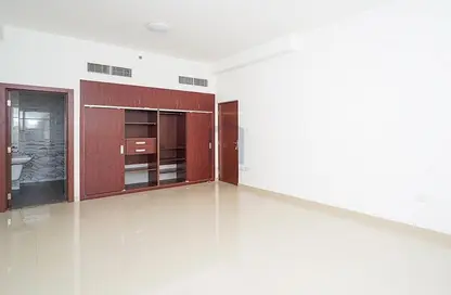 Empty Room image for: Apartment - 1 Bedroom - 1 Bathroom for rent in Al Amir Residence - Jumeirah Village Circle - Dubai, Image 1