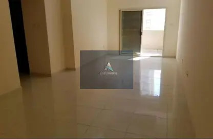Empty Room image for: Apartment - 2 Bedrooms - 2 Bathrooms for sale in Lilies Tower - Emirates City - Ajman, Image 1