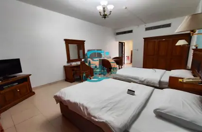 صورة لـ غرفة- غرفة النوم شقة - 1 حمام للايجار في شارع حمدان - أبوظبي ، صورة رقم 1