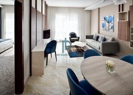 Living / Dining Room image for: Hotel and Hotel Apartment - 1 bedroom - 2 bathrooms for rent in Movenpick Hotel Apartments Downtown - Downtown Dubai - Dubai, Image 1