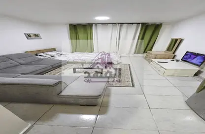 Living Room image for: Apartment - 1 Bathroom for rent in Sheikh Jaber Al Sabah Street - Al Naimiya - Al Nuaimiya - Ajman, Image 1