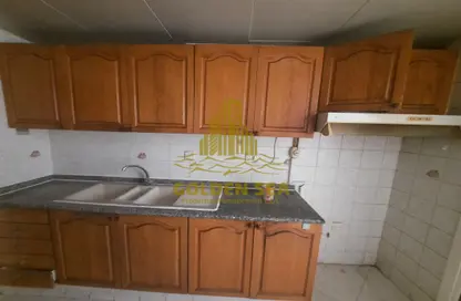 Kitchen image for: Apartment - 2 Bedrooms - 2 Bathrooms for rent in Golden Falcon Tower - Hamdan Street - Abu Dhabi, Image 1