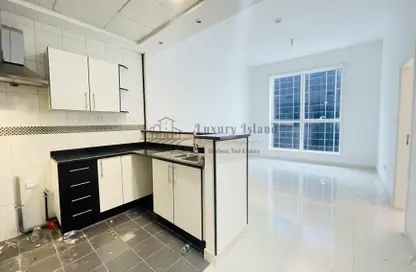 Kitchen image for: Apartment - 1 Bedroom - 2 Bathrooms for rent in Hamdan Street - Abu Dhabi, Image 1