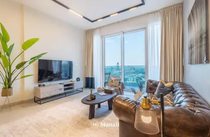 Living Room image for: Apartment - 2 Bedrooms - 2 Bathrooms for rent in 1 Residences - Wasl1 - Al Kifaf - Dubai, Image 1