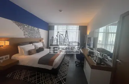 Room / Bedroom image for: Apartment - 1 Bathroom for sale in Sky Central Hotel - Barsha Heights (Tecom) - Dubai, Image 1
