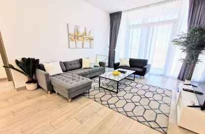 Living Room image for: Apartment - 1 Bedroom - 1 Bathroom for rent in Bloom Towers - Jumeirah Village Circle - Dubai, Image 1