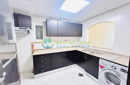 Kitchen image for: Apartment - 1 Bedroom - 2 Bathrooms for rent in Al Yousuf Towers - District 12 - Jumeirah Village Circle - Dubai, Image 1