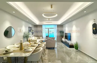 Living / Dining Room image for: Apartment - 1 Bedroom - 2 Bathrooms for sale in Ajman Creek Towers - Al Rashidiya 1 - Al Rashidiya - Ajman, Image 1