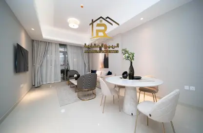 Living / Dining Room image for: Apartment - 1 Bedroom - 2 Bathrooms for sale in Gulfa Towers - Al Rashidiya 1 - Al Rashidiya - Ajman, Image 1