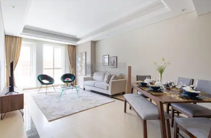 Living / Dining Room image for: Apartment - 2 Bedrooms - 3 Bathrooms for sale in Mon Reve - Downtown Dubai - Dubai, Image 1