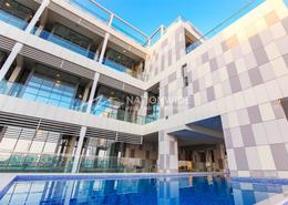 Pool image for: Duplex - 2 bedrooms - 2 bathrooms for sale in Al Raha Lofts - Al Raha Beach - Abu Dhabi, Image 1