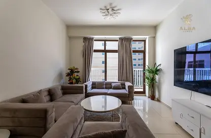 Living Room image for: Apartment - 1 Bedroom - 2 Bathrooms for rent in Laya Residences - Jumeirah Village Circle - Dubai, Image 1