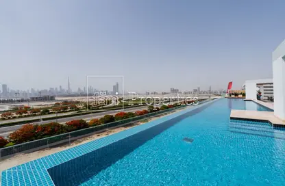 Pool image for: Apartment - 1 Bedroom - 2 Bathrooms for sale in Injazzat Residence - Meydan Avenue - Meydan - Dubai, Image 1
