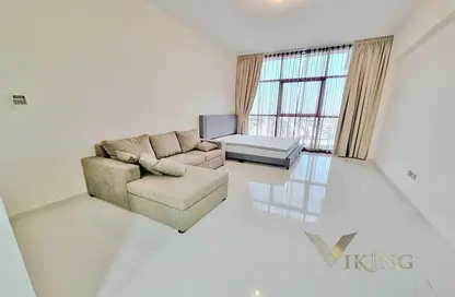Living Room image for: Apartment - 1 Bathroom for sale in Loreto 1 B - Loreto - DAMAC Hills - Dubai, Image 1