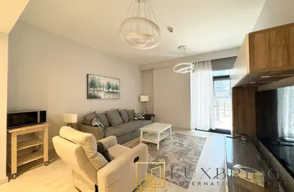 Living Room image for: Apartment - 1 Bedroom - 2 Bathrooms for rent in Park Point Building C - Park Point - Dubai Hills Estate - Dubai, Image 1