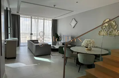Living / Dining Room image for: Apartment - 2 Bedrooms - 2 Bathrooms for rent in SLS Dubai Hotel  and  Residences - Business Bay - Dubai, Image 1