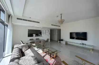 Living / Dining Room image for: Apartment - 2 Bedrooms - 3 Bathrooms for sale in Boulevard Crescent 1 - BLVD Crescent - Downtown Dubai - Dubai, Image 1