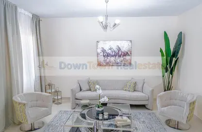 Living Room image for: Apartment - 2 Bedrooms - 3 Bathrooms for sale in Al Ameera Village - Ajman, Image 1