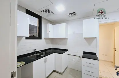 Kitchen image for: Townhouse - 2 Bedrooms - 4 Bathrooms for rent in Nasma Residence - Al Tai - Sharjah, Image 1
