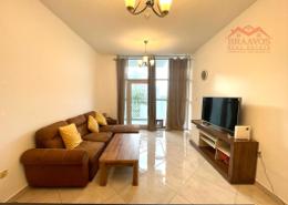 Living Room image for: Apartment - 1 bedroom - 2 bathrooms for rent in Chaimaa Premiere - Jumeirah Village Circle - Dubai, Image 1