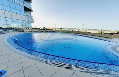 صورة لـ حوض سباحة شقة - 2 غرف نوم - 2 حمامات للايجار في برج سي فيو - شمس أبوظبي - جزيرة الريم - أبوظبي ، صورة رقم 1