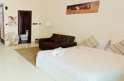 Room / Bedroom image for: Apartment - 1 Bathroom for rent in Wavez Residence - Liwan - Dubai Land - Dubai, Image 1