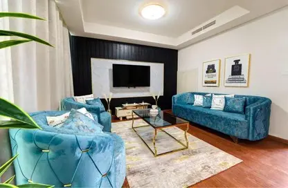 Living Room image for: Townhouse - 3 Bedrooms - 3 Bathrooms for rent in Albizia - Damac Hills 2 - Dubai, Image 1
