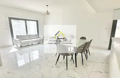 Living / Dining Room image for: Apartment - 4 Bedrooms - 2 Bathrooms for sale in Al Raha Lofts - Al Raha Beach - Abu Dhabi, Image 1