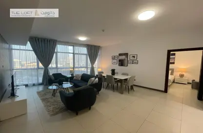 Living / Dining Room image for: Apartment - 2 Bedrooms - 3 Bathrooms for rent in AD One Tower - Capital Centre - Abu Dhabi, Image 1
