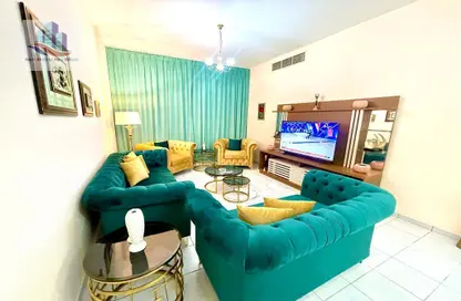Living Room image for: Apartment - 2 Bedrooms - 2 Bathrooms for rent in Al Qasba - Sharjah, Image 1