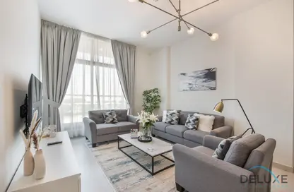 Living Room image for: Apartment - 1 Bedroom - 1 Bathroom for rent in Prime Views by Prescott - Meydan Avenue - Meydan - Dubai, Image 1
