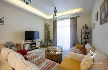 Living Room image for: Apartment - 2 Bedrooms - 3 Bathrooms for sale in Sherlock House 1 - Sherlock House - Motor City - Dubai, Image 1