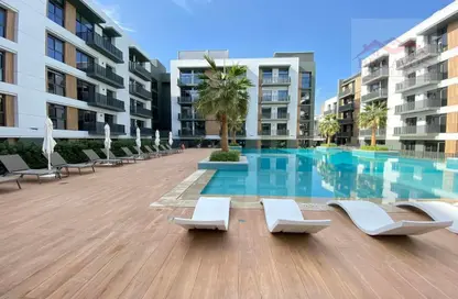 Pool image for: Apartment - 2 Bedrooms - 3 Bathrooms for rent in Belgravia Square - Jumeirah Village Circle - Dubai, Image 1