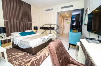 Room / Bedroom image for: Apartment - 1 Bathroom for sale in Bay's Edge - Business Bay - Dubai, Image 1