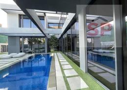 Pool image for: Villa - 5 bedrooms - 8 bathrooms for sale in Sequoia - Masaar - Tilal City - Sharjah, Image 1