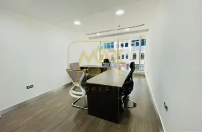 Office image for: Co-working space - Studio - 4 Bathrooms for rent in Hanging Garden Tower - Al Danah - Abu Dhabi, Image 1