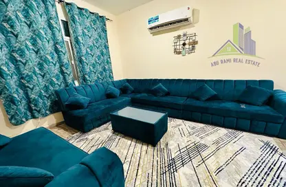 صورة لـ غرفة المعيشة شقة - 2 غرف نوم - 2 حمامات للايجار في 2 المويهات - المويهات - عجمان ، صورة رقم 1