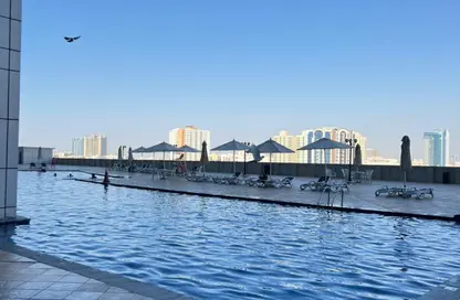 Apartment - 1 Bedroom - 2 Bathrooms for sale in Corniche Tower - Ajman Corniche Road - Ajman