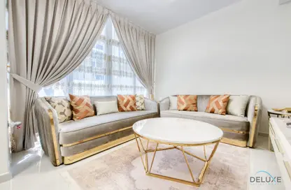 Living Room image for: Townhouse - 3 Bedrooms - 2 Bathrooms for rent in Albizia - Damac Hills 2 - Dubai, Image 1