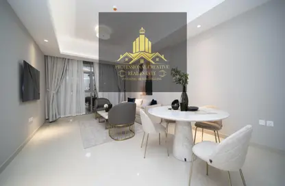 Living / Dining Room image for: Apartment - 2 Bedrooms - 2 Bathrooms for sale in AZHA Community - Al Amerah - Ajman, Image 1
