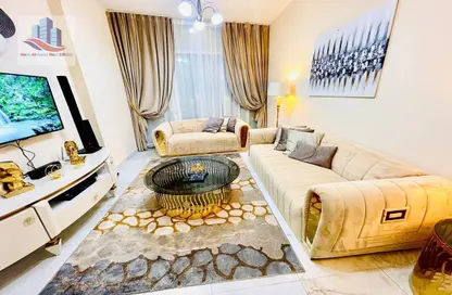 Living Room image for: Apartment - 1 Bedroom - 2 Bathrooms for rent in Al Qasba - Sharjah, Image 1