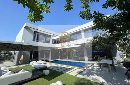 Outdoor House image for: Villa - 6 Bedrooms for sale in Sequoia - Masaar - Tilal City - Sharjah, Image 1