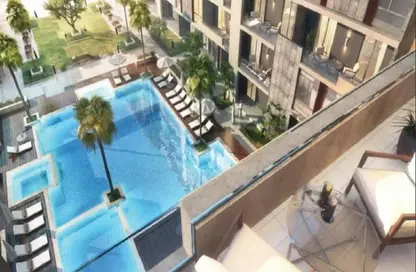 Pool image for: Apartment - 1 Bathroom for sale in Rukan 3 - Rukan - Dubai, Image 1