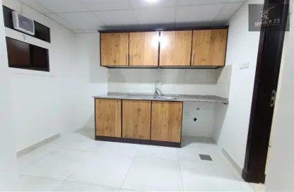 Kitchen image for: Apartment - 1 Bathroom for rent in Mohammed Villas 24 - Mohamed Bin Zayed City - Abu Dhabi, Image 1