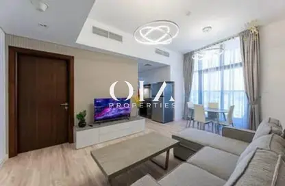 Living Room image for: Apartment - 1 Bedroom - 2 Bathrooms for sale in O2 Tower - Jumeirah Village Circle - Dubai, Image 1
